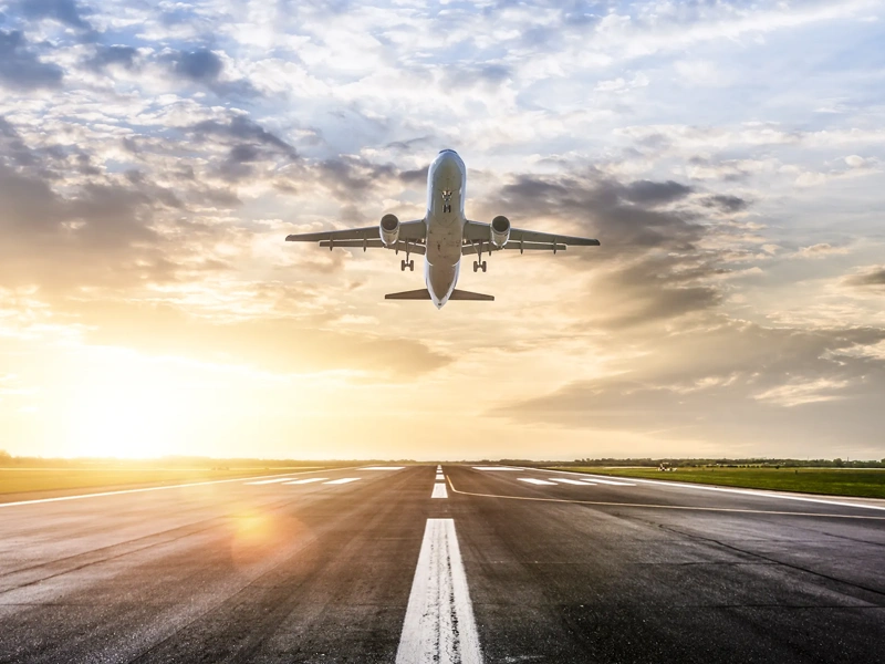 Passenger airplane taking of at sunrise