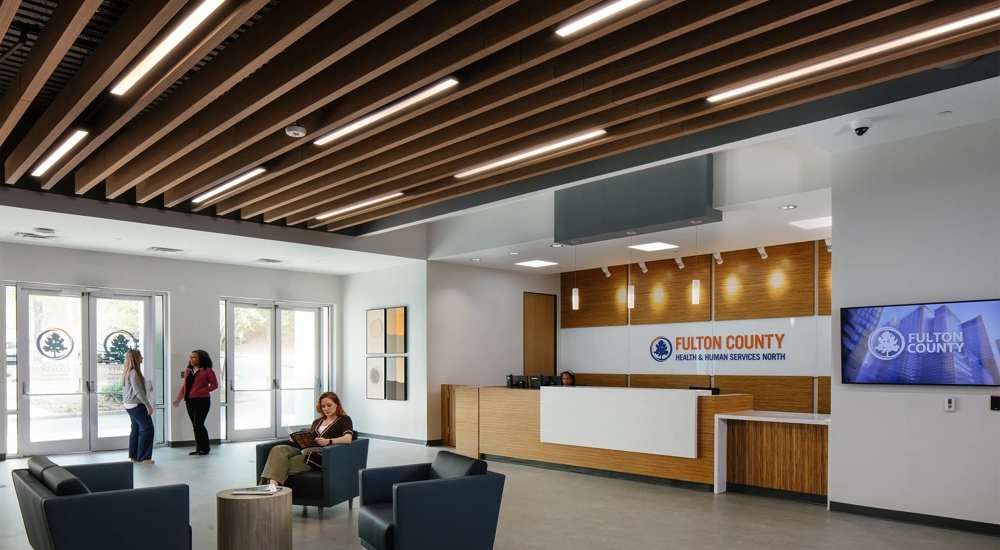 Reception waiting room at a health services, with women on armchairs